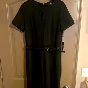 Tommy Hilfiger brand new Black Jumpsuit. Beautiful detail cutout pattern.